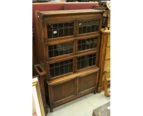 Early 20th century Oak Book Shelf / Cabinet, the Three Upper Sections each with Two Leaded Glazed Doors above Lower Cupboard 