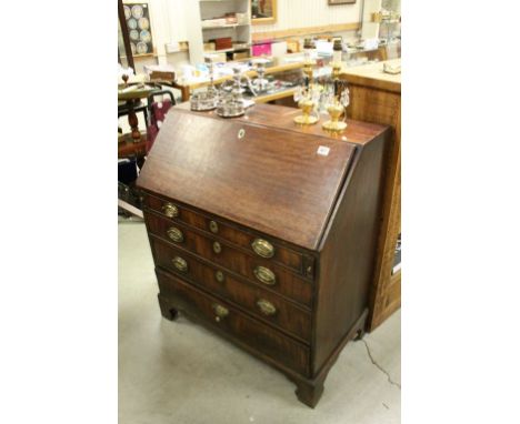 Georgian Mahogany Bureau, the drop front with fitted interior, four long drawers and raised on Bracket feet, 92cms wide x 107