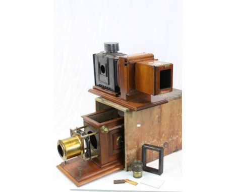Two Late 19th Magic Lanterns, one contained in a wooden transporting box (front missing)