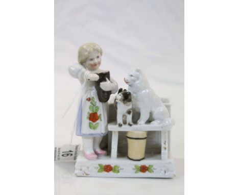 19th century Continental Ceramic Match Holder and Striker in the form of a Girl with a Cat and Dog, 12cms high