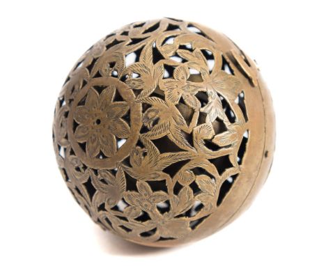 A 19th century Chinese brass shadow ball:, the pierce work bird and fauna engraved ball enclosing a gimballed oil lamp, 8cm d