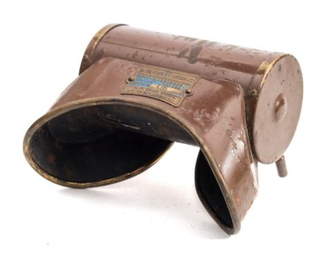 A tinplate rotary viewer by Baird & Tatlock, London:, the cylindrical body enclosing a rotating drum with narrow slits, overp