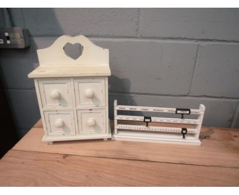 A vintage style abacus perpetual desk calendar together with a rustic bank of four drawers