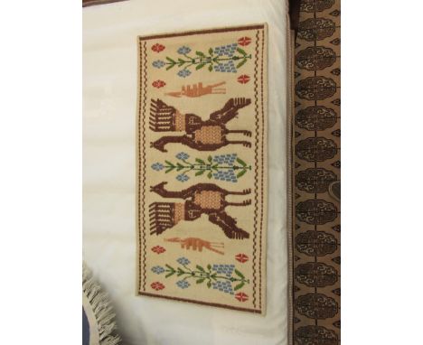 A wool tapestry of Persian influence with figural form and flower design, from The Denis Taplin' Gallery, Woodbridge, 40 x 81