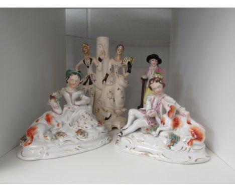 A Staffordshire figure of a gent in hat holding a potted plant, a pair of Staffordshire style figures and a ceramic figural g