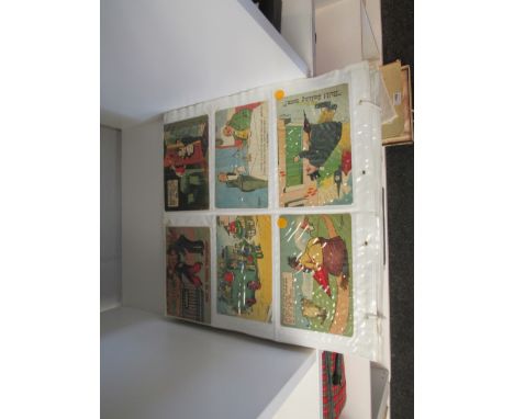 An album containing various vintage postcards including humorous 