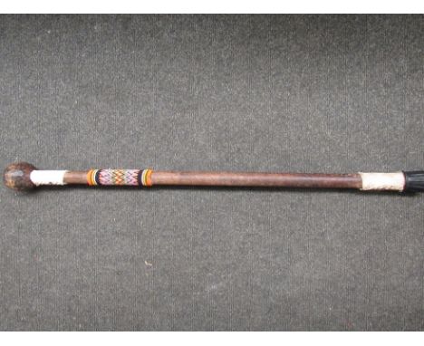 An ethnic club converted to a walking stick 