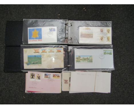 A box containing Australian First Day Covers of the 1980's in two presentation albums. Plus special edition stamps and sets o