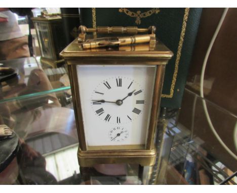 A French carriage clock a/f housed in a book with key