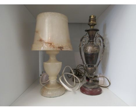 An onyx carved lamp with green baize base and one other silver plate example on red marble base