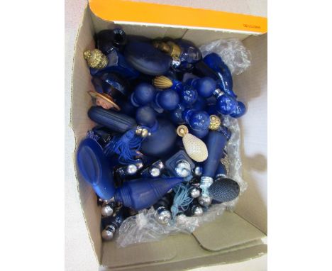 A box containing a quantity of blue glass and ceramic perfume bottles 