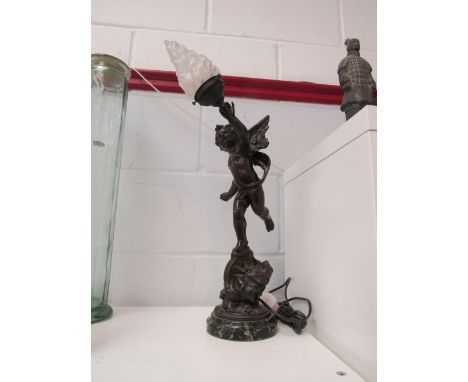 A late 19th Century bronzed cherub lamp after Emile Bruchon (1806-1891) mounted on a marble base with brass plaque "L'Amour V