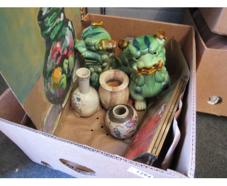 A box of Oriental items including a large pair of ceramic dogs of fo and a folding mirror