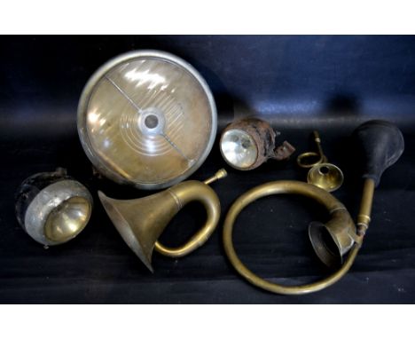 A Large Lucas Headlamp, 35 cms diameter, together with two other lamps and three brass horns