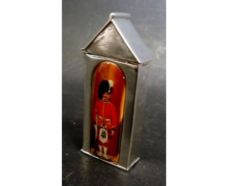 A Sterling Silver Vesta Case with Enamel Decoration in the form of a Guard within a Sentry Box, 6 cms tall