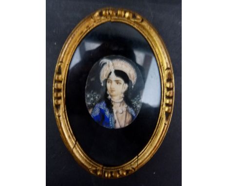 A Small Oval Portrait Miniature of an Eastern Girl with Headdress, 4.5 x 3.5 cms