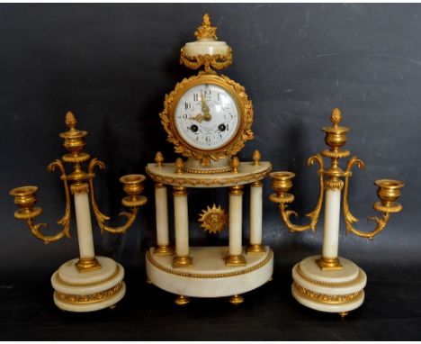 A Late 19th Early 20th Century French White Marble and Gilt Metal Mounted Three Piece Clock Garniture, Portico Clock with ena