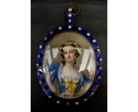 A 19th Century Oval Portrait Miniature in the Form of a Lady in Period Dress, within a blue enamel paste stone set frame, 10 