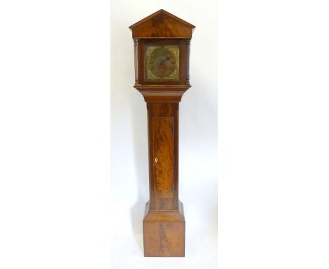 A 19th Century Mahogany Long Case Clock, the architectural hood with turned pilasters above a panel door and conforming plint