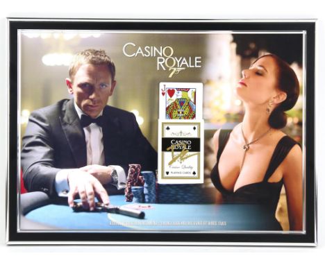 James Bond Casino Royale - 'Cartamundi Casino Royale' playing card and box signed by Daniel Craig, mounted on mini poster in 
