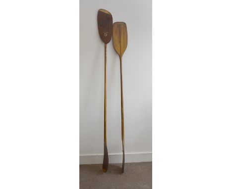 Two vintage double bladed wooden paddles, one by Gees of Twickenham, 220 cm, the other Mitchwood Chester, 206 cm (2) 