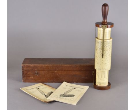 A cased Stanley Fuller calculator, turned wooden handle, brass stand, instruction manual, restored 1965 (case af) 