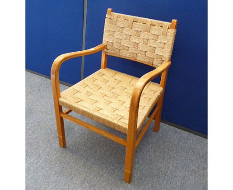 A vintage beech cottage arm chair, with cord back and seat 