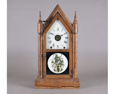 An American Seth Thomas wooden cased gothic mantle clock, eight day, Roman numerals, painted glass roundel, 53 cm 