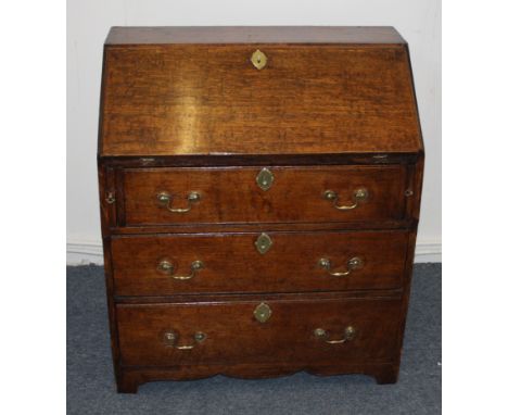 An 18th Century cottage oak and pine bureau, fall front above three graduated long drawers with brass swan-necked handles, 76