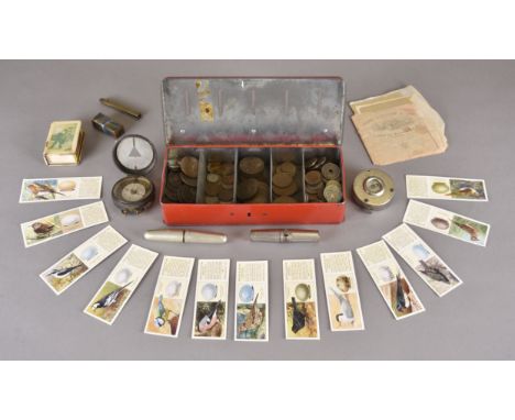 A miscellaneous collection, including a WW1 compass, tea cards, coins, gold leaf etc 