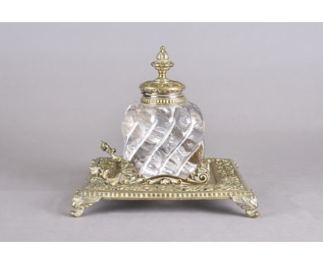 A Victorian heavy glass and brass inkwell, square base with central glass well, in gothic style on bracket feet (af) 22.5 cm 