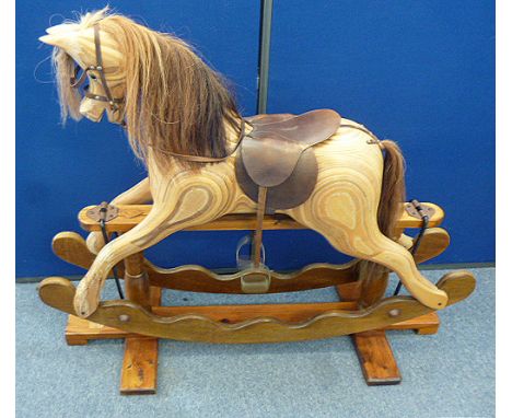 A vintage wooden rocking horse, laminated construction, by Ian Armstrong, Durham, 40 cm wide x 104 cm high 