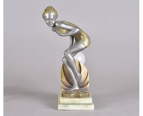 An Art Deco table lamp with a gold painted spelter figure of a woman crouching, on a rectangular stepped base, 28 cm highNot 