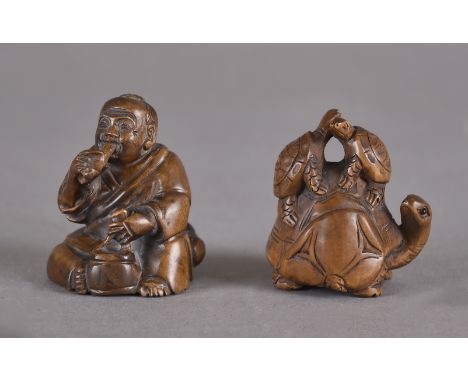 ANNOUNCE This lot only contains one netsuke, of a man smoking a pipeTwo hardwood netsuke, one of three tortoises, 4cm high, t