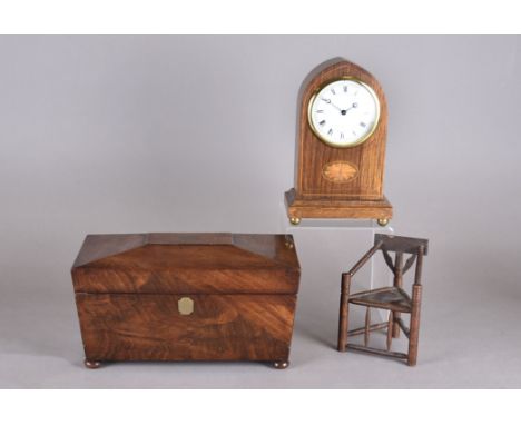 An Edwardian oak arched mantle clock, with satinwood inlaid cartouche, white circular dial, Roman and Arabic numerals, blued 