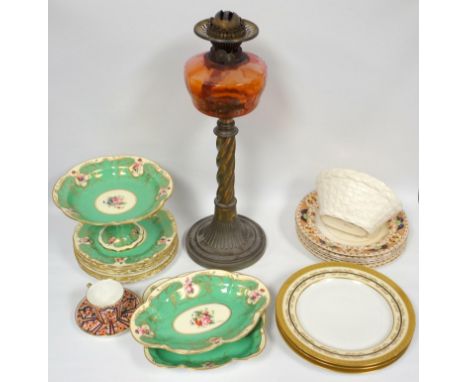 Two Royal Worcester oval dishes and six plates, all painted with flowers on an apple green reserve with gilt decoration, puce