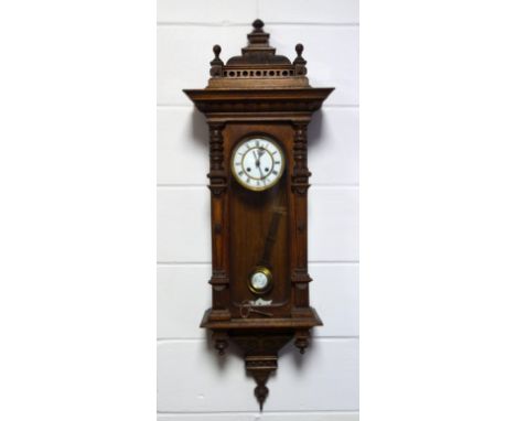 Vienna regulator in carved oak architectural case, enamel chapter ring with Roman numerals, C. 1880, height 120 cm. 