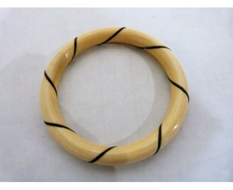 An ivory and inlaid bangle