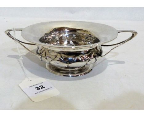 An Edward VII Arts and Crafts silver bowl by Wiliam Hair Haseler of typically stylised design. 7¾'' wide over handles. Birmin