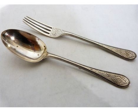 A Victorian spoon and fork with engraved decoration. Sheffield 1888. 2ozs 4dwts