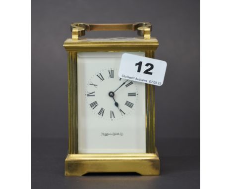 A Mappin and Webb gilt brass carriage clock, H. 15cm (not currently in working order, attention required to door).