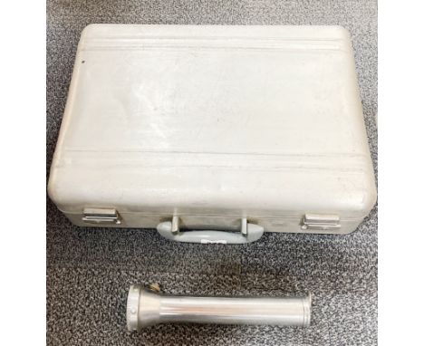 A vintage aluminium briefcase and torch.