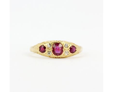 An antique 18ct yellow gold ruby and diamond set ring, (L).