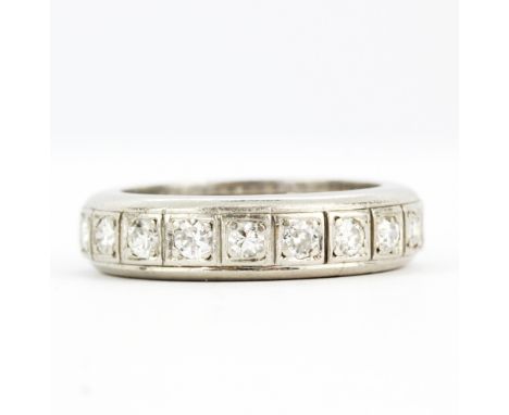 A heavy white gold and platinum full eternity ring set with brilliant old cut diamonds, (K).