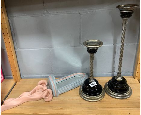A pair of ceramic and metal candlesticks, tallest H. 49cm, with a painted wall mirror.