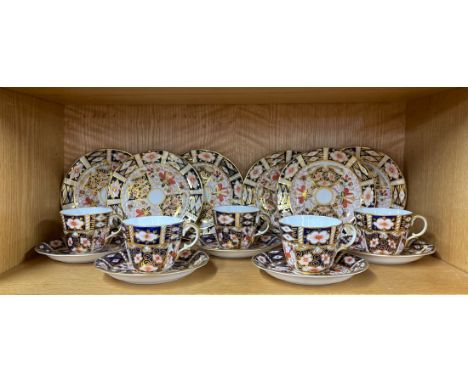 Five Royal Crown Derby cups and saucers with six plates, one cup handle restored.