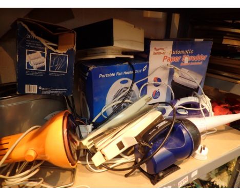 Shelf of electricals including shredder heater torch toaster blender iron etc   CONDITION REPORT:  The electrical items inclu