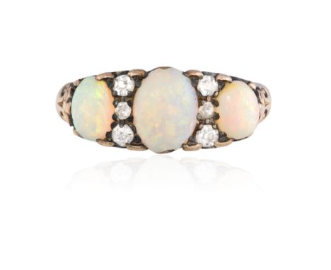 AN OPAL AND DIAMOND RING, set with three oval cabouchon stones between rose-cut diamonds with pierced shoulders, mounted in 1