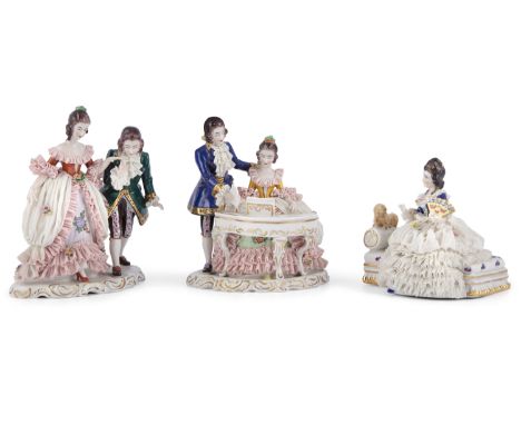 THREE DRESDEN PORCELAIN FIGURAL GROUPS, the first comprising a standing couple, the second of a couple at a piano with the la