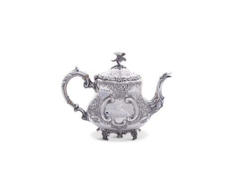 AN EDWARDIAN SILVER TEAPOT, Birmingham 1908, mark of W. G Keight Sons &amp; Co., of baluster shape with eagle finial, the bod